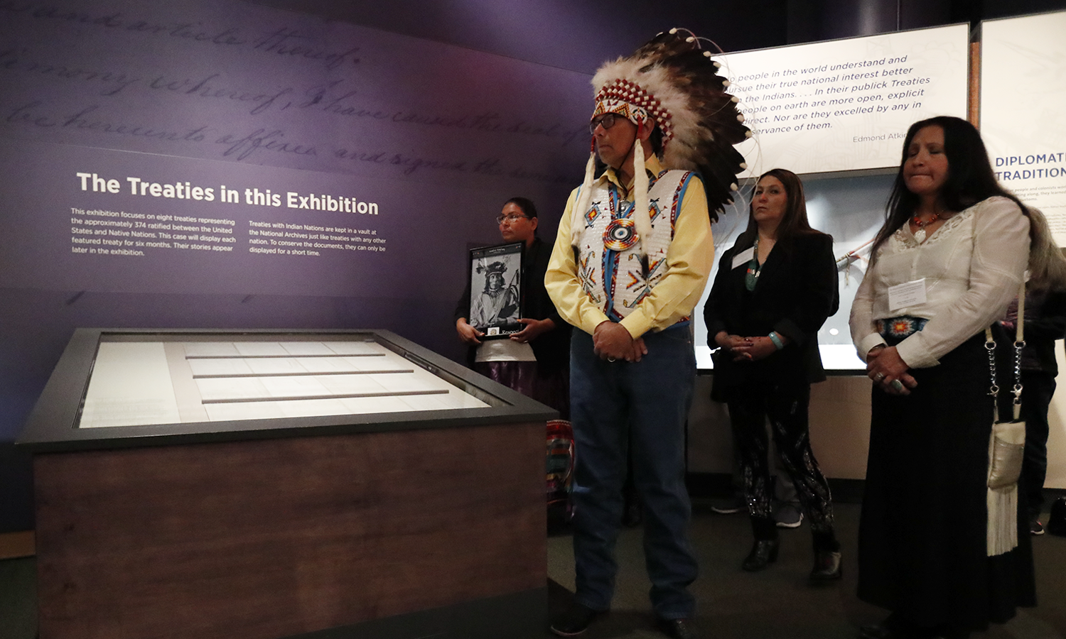 Ramey Growing Thunder (Fort Peck Sioux and Assiniboine Tribes), Chief John Spotted Tail (Rosebud Sioux Tribe), Carolyn Brugh (Fort Peck Sioux and Assiniboine Tribes), and Tamara Stands and Looks Back–Spotted Tail (Rosebud Sioux Tribe) take part in a ceremony at the National Museum of the American Indian honoring the Treaty of Fort Laramie. Ms. Growing Thunder holds a photograph of Medicine Bear (Yanktonai Band of Sioux), one of the Native leaders who signed the treaty 150 years ago. Delegations from the Yankton Sioux Tribe, Oglala Sioux Tribe, and Northern Arapaho Tribe also traveled to Washington, D.C., for the installation of the treaty in the exhibition 