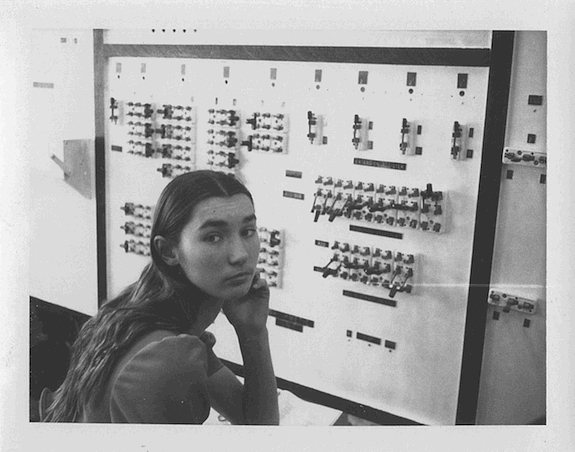 Dawn LeClair, member of the 1975 Wickenburg High School Math Club, sits in front of the paper clip computer.