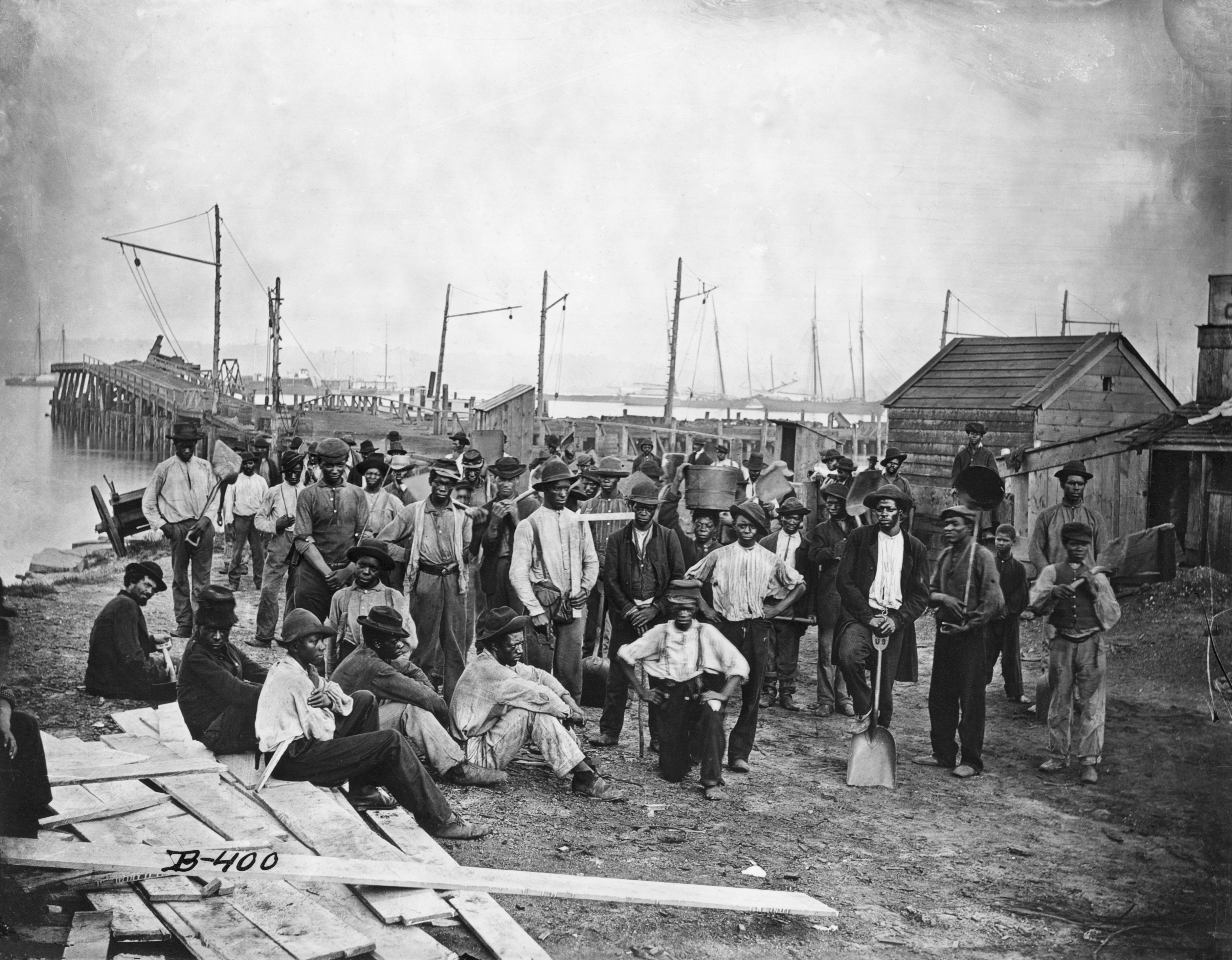 Black Americans along with a wharf