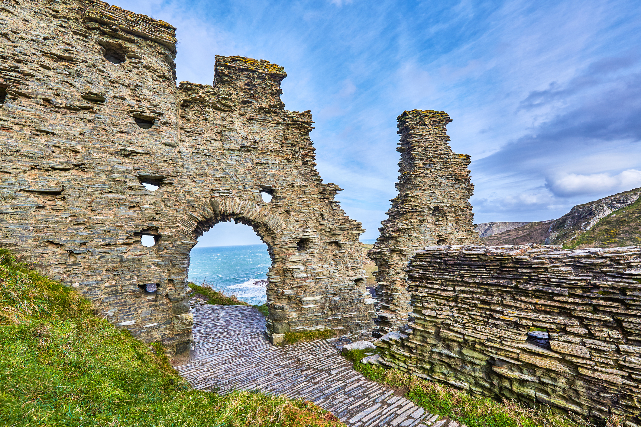 Tintagel Castle, a dramatic 13th century fortress on the rocky coast of Cornwall, England, has been associated with King Arthur.