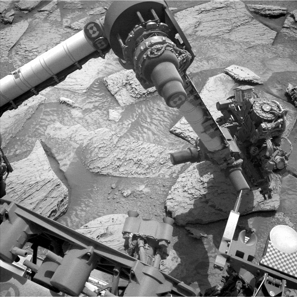 a gif of Curiosity's robotic arm maneuvers as seen from above