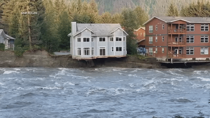 Gif of a house collapsing into the river