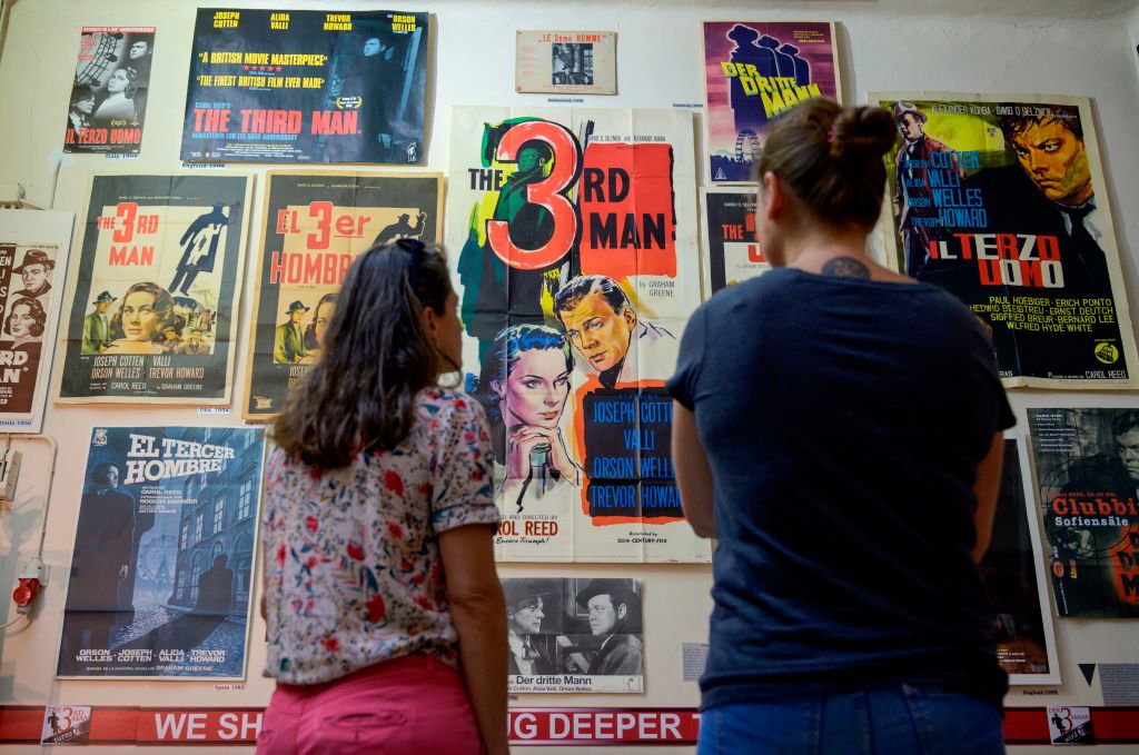 Visitors look at posters in the Third Man Museum in Vienna.